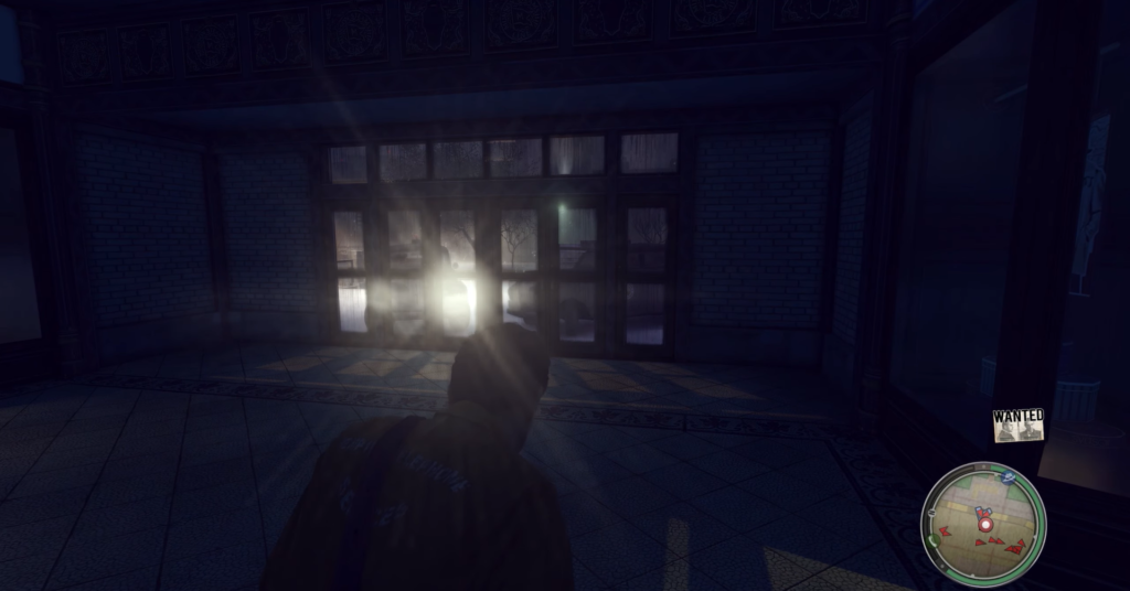 Персонаж Mafia II идет к стеклянным дверям ночью