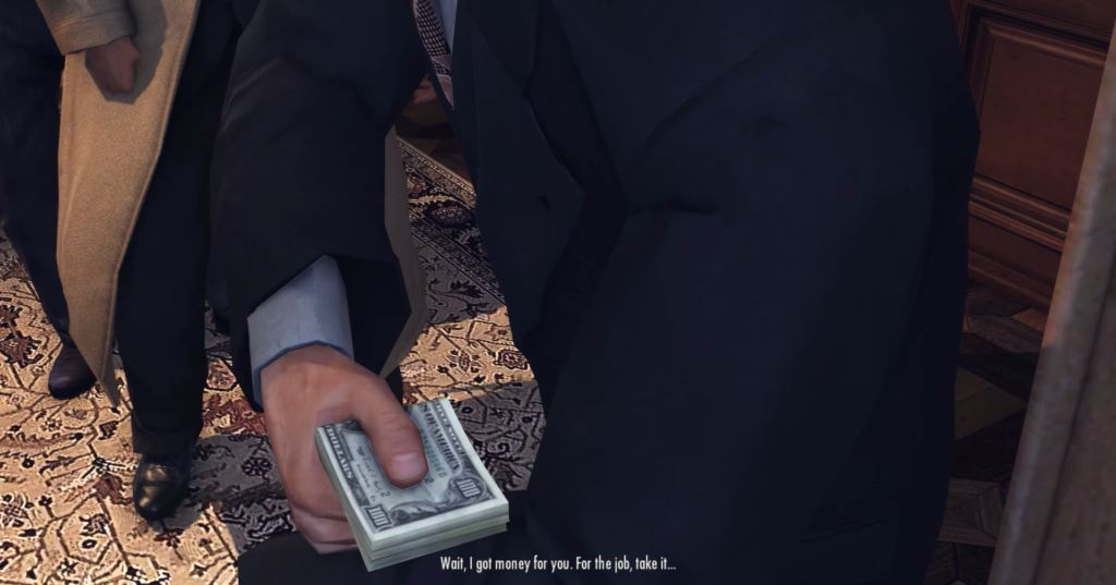 Рука в костюме держит пачку долларов в комнате