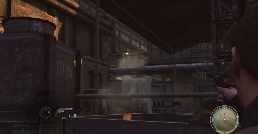 Персонаж целится из пистолета на заводе в Mafia II