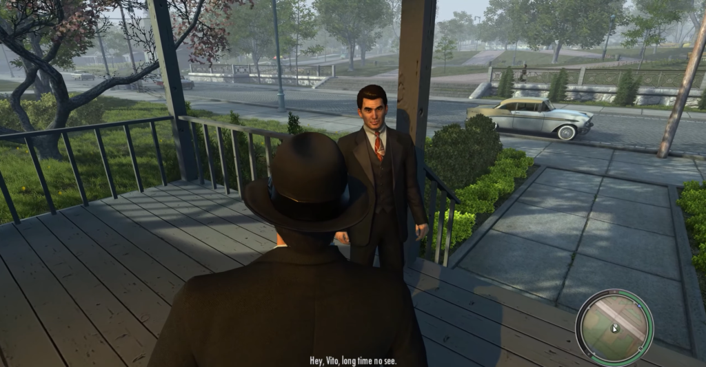 Вито Скалетта разговаривает с мужчиной на крыльце Mafia II
