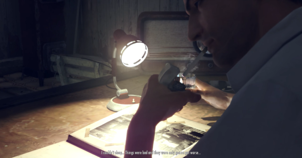 Мужчина курит сигарету за столом под лампой