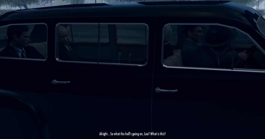 Мужчины в костюмах едут в черном автомобиле