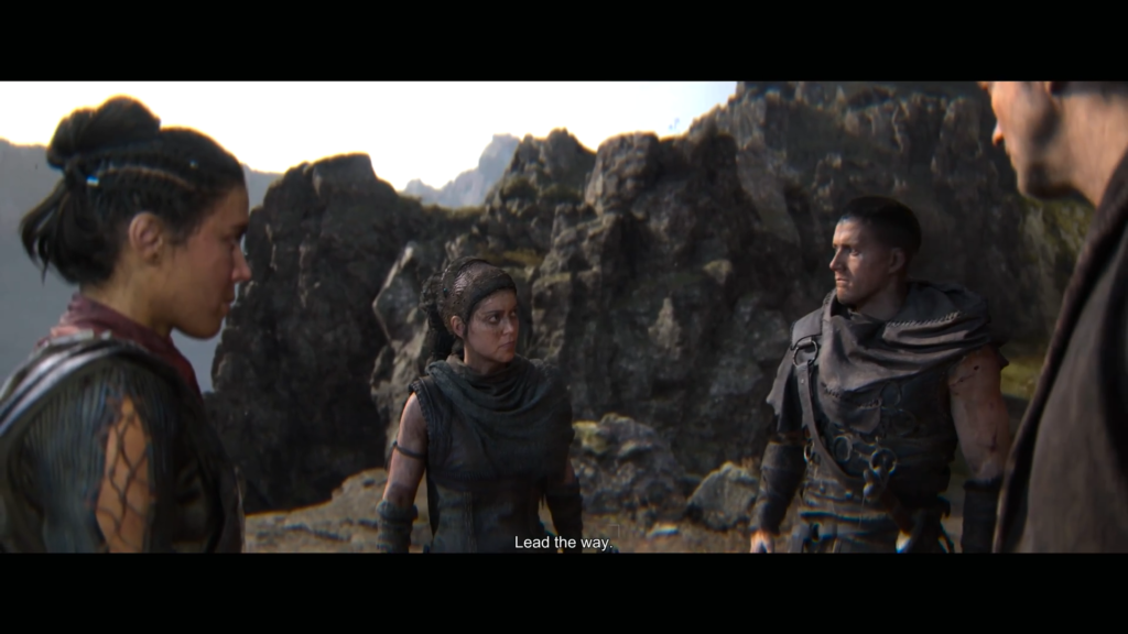 Игрок разговаривает с Томасом Брауном в библиотеке Hogwarts Legacy