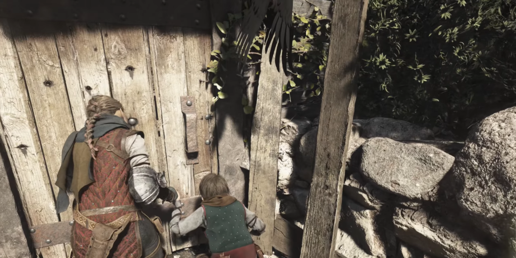 Амиция и Гуго открывают деревянную дверь у скал