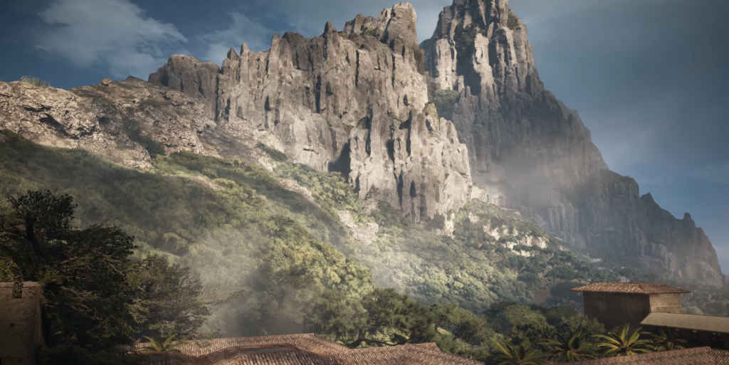 Скалистая гора возвышается над лесом и крышами домов