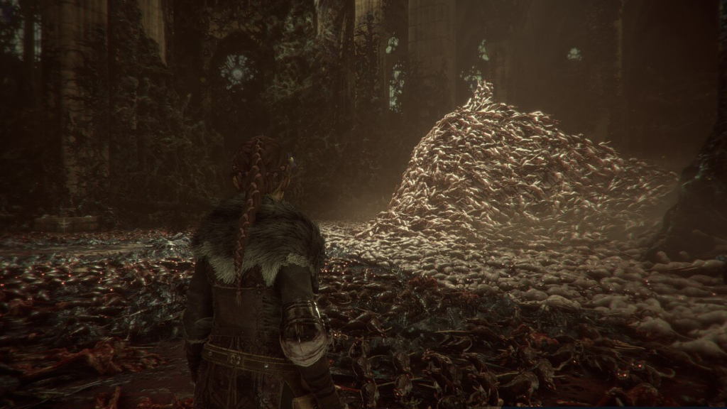 Амиция из A Plague Tale смотрит на кучу крыс в соборе